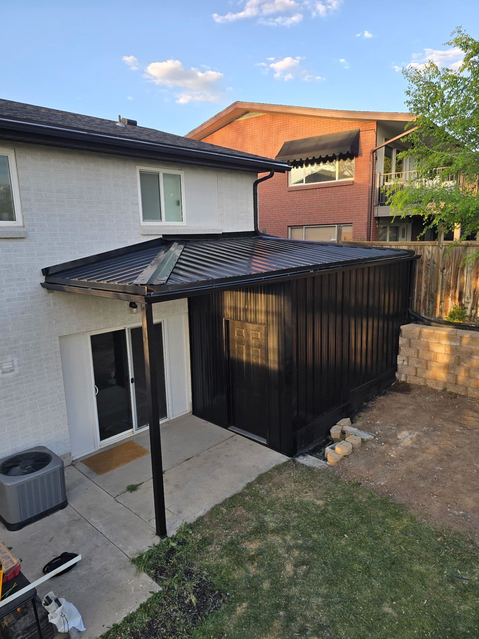 Open Patio Enclosed Into a Functional Outdoor Storage Space image