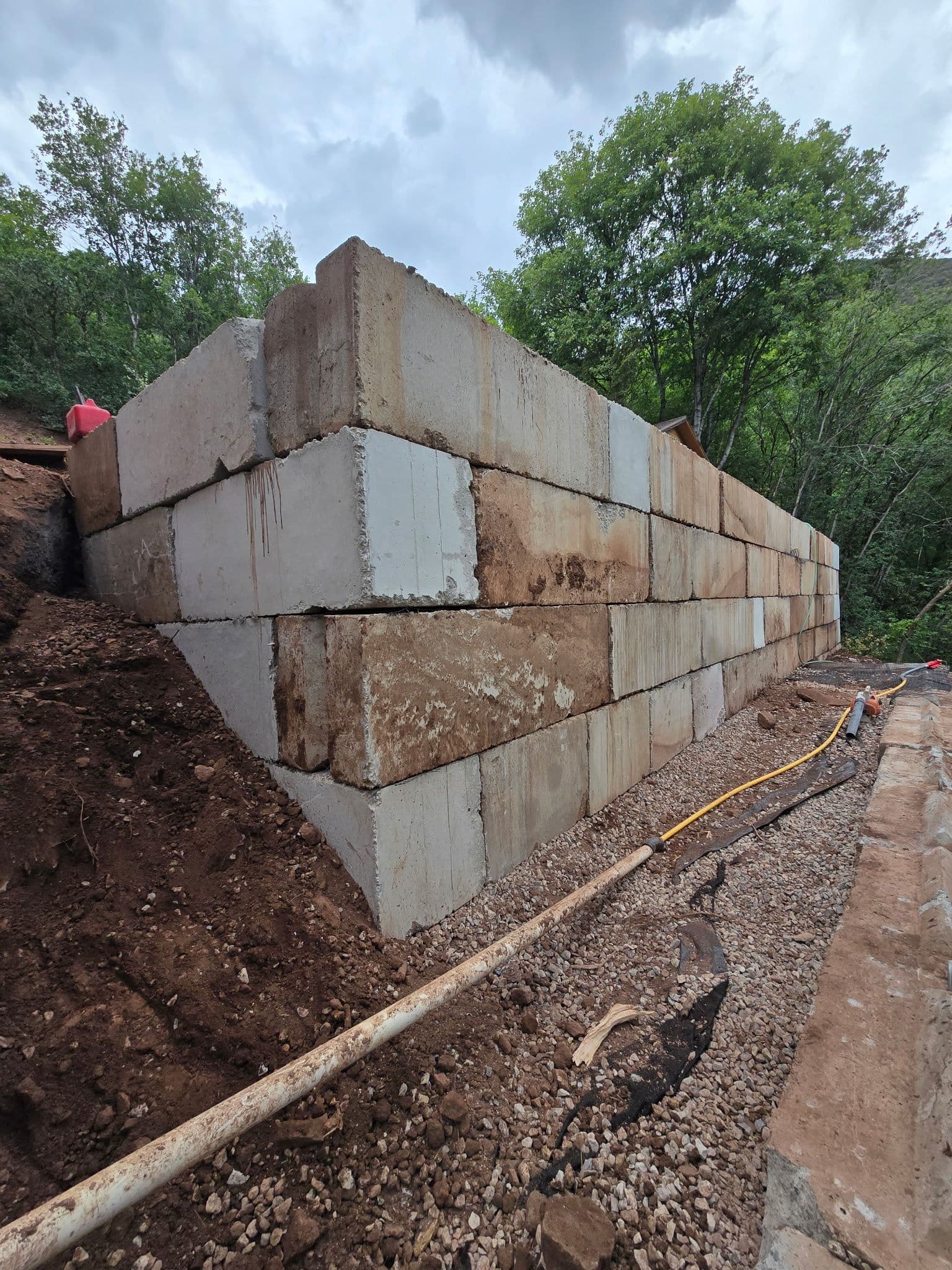 Massive Concrete Block Retaining Wall Built for a Cabin-Area Slope image